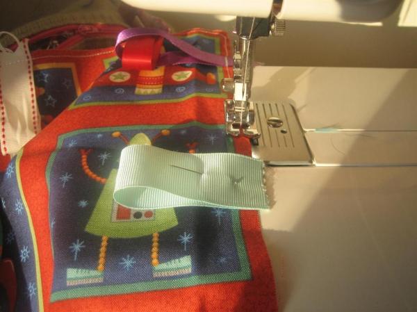 Stitching all ribbons onto main fabric
